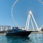 Luxury 95 ft yacht side view sailing in Dubai, ideal for private yacht hire for large groups