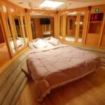 Double bed cabin in 95 ft yacht, combining luxury and comfort for private yacht stays in Dubai