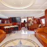 Luxurious living salon inside 95 ft yacht, designed for upscale group entertainment in Dubai