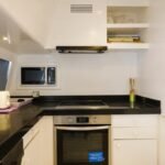 Fully-equipped kitchen on 95 ft yacht, catering to luxury group charters in Dubai