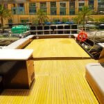 Spacious upper deck of Dubai's 95 ft yacht, suited for private events and group gatherings