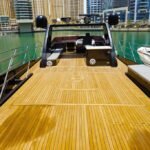 Spacious upper deck of Dubai's 95 ft yacht, suited for private events and group gatherings