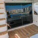Spacious exterior deck seating on the 48 ft yacht, perfect for relaxation and socializing on a Dubai boutique yacht charter