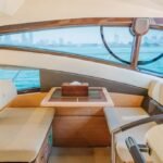 Spacious exterior deck seating on the 48 ft yacht, perfect for relaxation and socializing on a Dubai boutique yacht charter