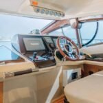 Captain's area on the 48 ft yacht, featuring advanced navigation equipment for a safe and smooth sailing experience in Dubai