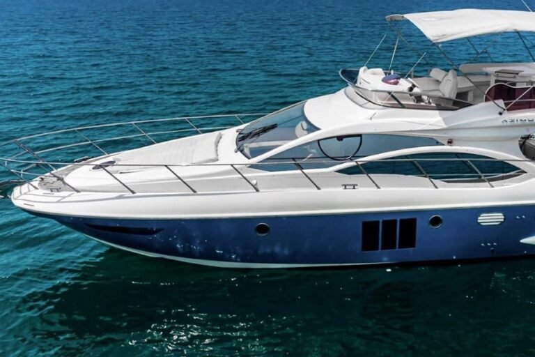 Side view of the sleek 48 ft motor yacht, showcasing its grandeur and style, ideal for boutique yacht charters in Dubai