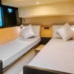 Twin single bed cabin, combining functionality and elegance, perfect for family-friendly yacht charters in Dubai