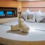 Luxurious double bed cabin in the yacht, offering privacy and comfort for guests on a boutique yacht charter in Dubai