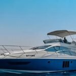 Full side view of the sleek 48 ft motor yacht, showcasing its grandeur and style, ideal for boutique yacht charters in Dubai