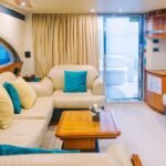 Elegant lounge area inside the motor yacht, providing a luxurious setting for a yacht booking Dubai