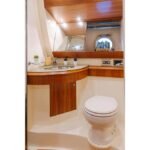 Well-appointed bathroom in the motor yacht's cabin, adding convenience to your yacht booking Dubai
