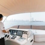 Yacht's helm, safely navigating through Dubai's waters for a family yacht adventure