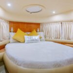 Comfortable double bed cabin in the yacht, offering a peaceful retreat during your hourly yacht rental in Dubai