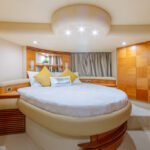 Comfortable double bed cabin in the yacht, offering a peaceful retreat during your hourly yacht rental in Dubai