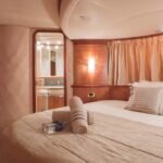 Comfortable double bed cabin in the yacht, ideal for couples on a Private Yacht for Family and Friends voyage in Dubai