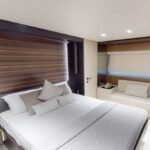 Double bed cabin in the yacht, offering a peaceful retreat, included in the Dubai boat cruise cost