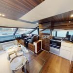 Dining area inside the yacht, enhancing the dining experience within the daily boat cruise Dubai