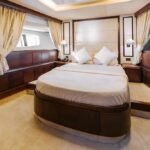 Comfortable double bed cabin in the yacht, offering a peaceful retreat, included in the Dubai yacht rental cost