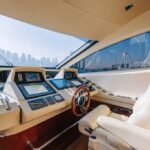 Captain's helm on the yacht, guiding through Dubai's waters for a unique and cost-effective yacht hire experience