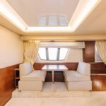 Lounge area inside the yacht, a luxurious space for relaxation, part of our competitive Dubai yacht rental cost