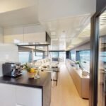 78 ft Ultra Luxury Yacht 15 Guest 15 Elegant lounge area inside the yacht, reflecting the opulence offered by luxury yacht rental services Dubai for relaxation and socializing