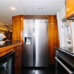 Kitchen on the yacht, equipped for serving culinary delights, a highlight of our Dubai daily yacht rental deals