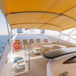 Deck of the 82 ft yacht, a prime spot for leisure and entertainment, reflecting the value of our Dubai daily yacht rental cost
